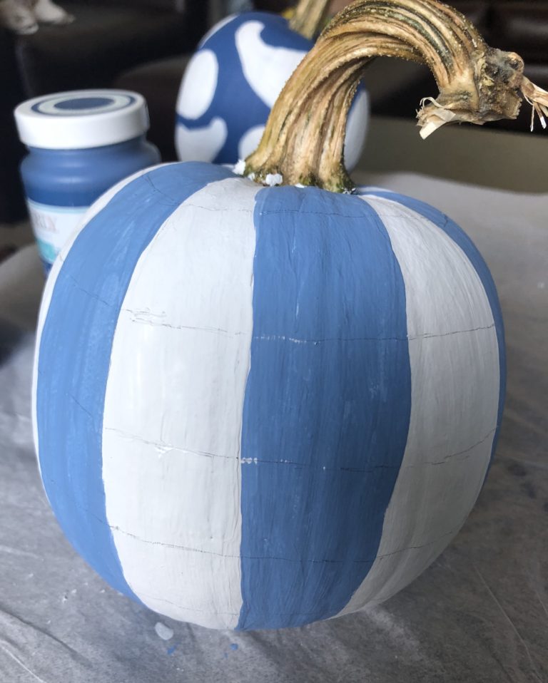 Learn how to paint a DIY  blue and white buffalo check pumpkin. These plaid pumpkins are a great addition to rustic farmhouse decor.