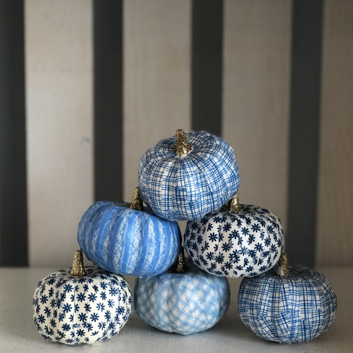 Blue and white DIY washi tape pumpkin decorations for Halloween or fall.