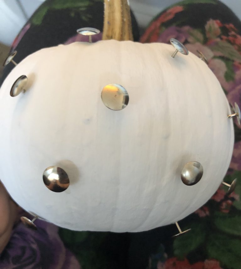 Learn how to make an easy DIY blue and white polka dot pumpkin with thumbtacks and paint.