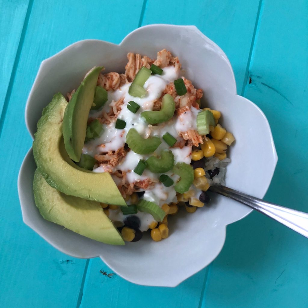 Buffalo chicken bowl recipe. Learn how to make the best healthy buffalo chicken in the crockpot! Then, make meal prep easier and more exciting with these four recipes all using the buffalo chicken! #healthycrockpotrecipe #healthyslowcookerrecipe #healthybuffalochicken #mealprep