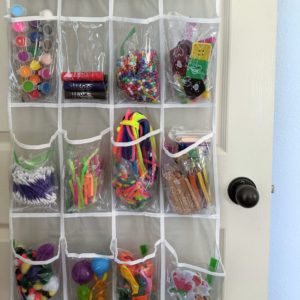 A simple kids craft supply organization idea: use an inexpensive over the door shoe organizer to keep small pieces tidy. #cheap #inexpensive #frugal #artsupplies #artsandcrafts #organization